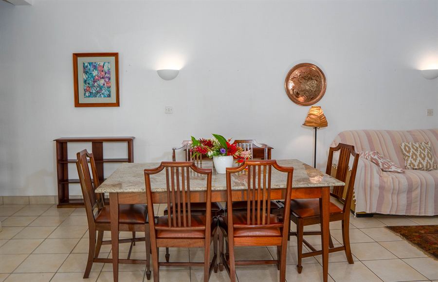Dining table and sitting area in a bright living room