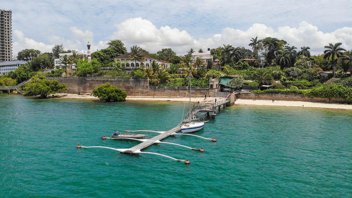The jetty and pontoon from the air, with a yacht moored