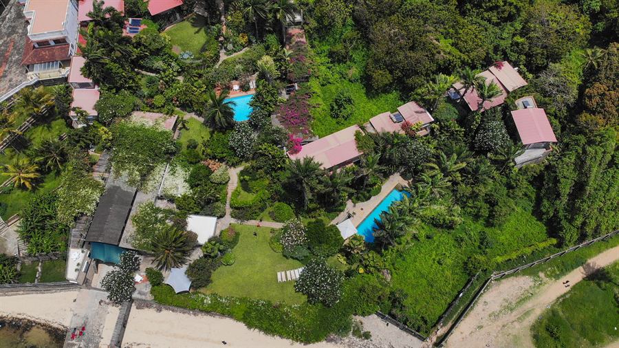 The residences and both pools seen from above, set in the gardens