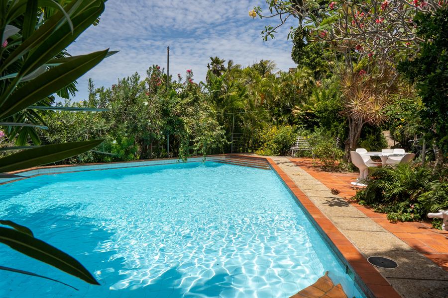 The terrace pool, with a white table in the shade